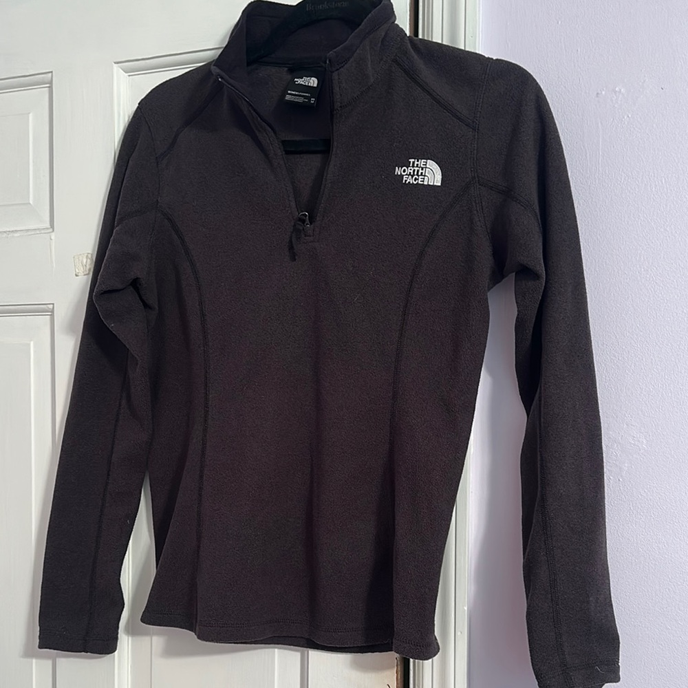 The North Face Women's Black Fleece 1/4 zip.